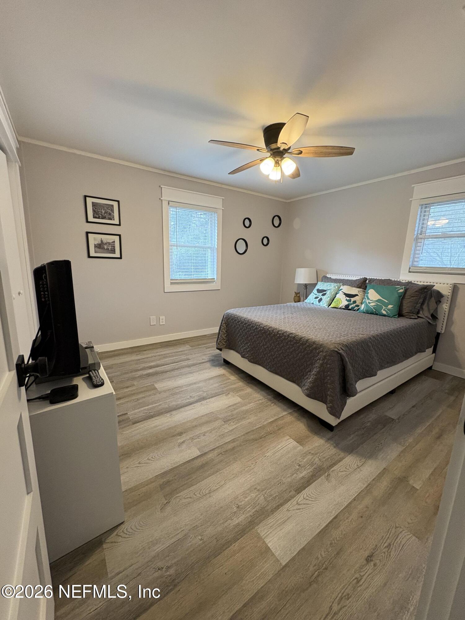 165 Fulton Road Palatka, FL 32177 - Photo 22 of 26 a bedroom with a bed and a flat screen tv