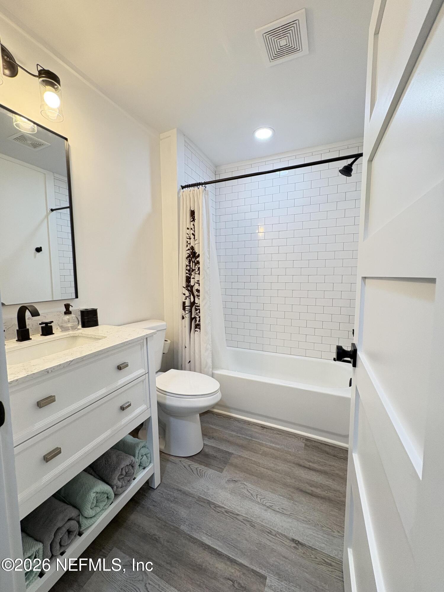 165 Fulton Road Palatka, FL 32177 - Photo 24 of 26 a bathroom with a bathtub shower sink vanity and toilet