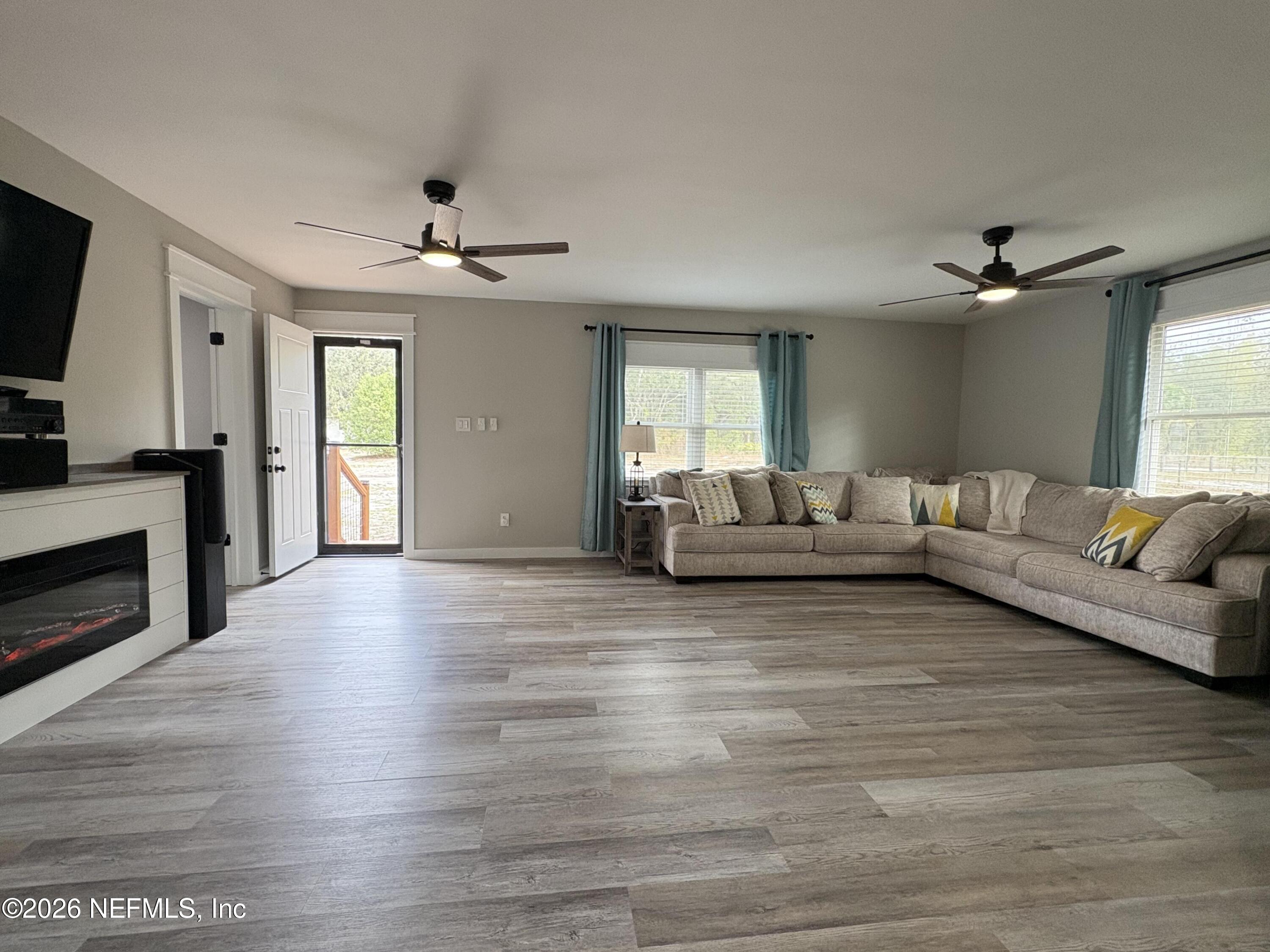 165 Fulton Road Palatka, FL 32177 - Photo 6 of 26 a living room with furniture and a fireplace