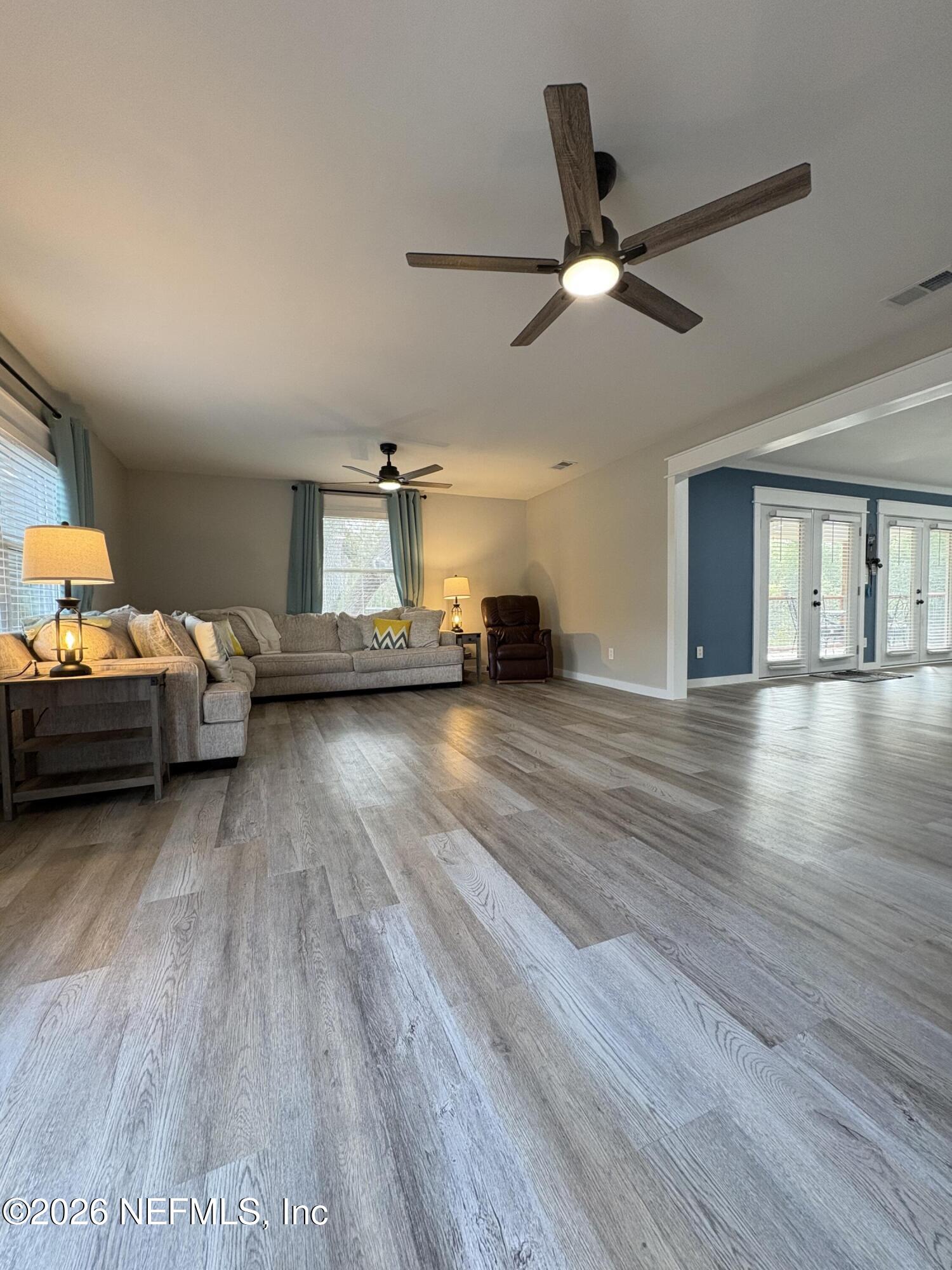 165 Fulton Road Palatka, FL 32177 - Photo 8 of 26 a living room with furniture and a wooden floor