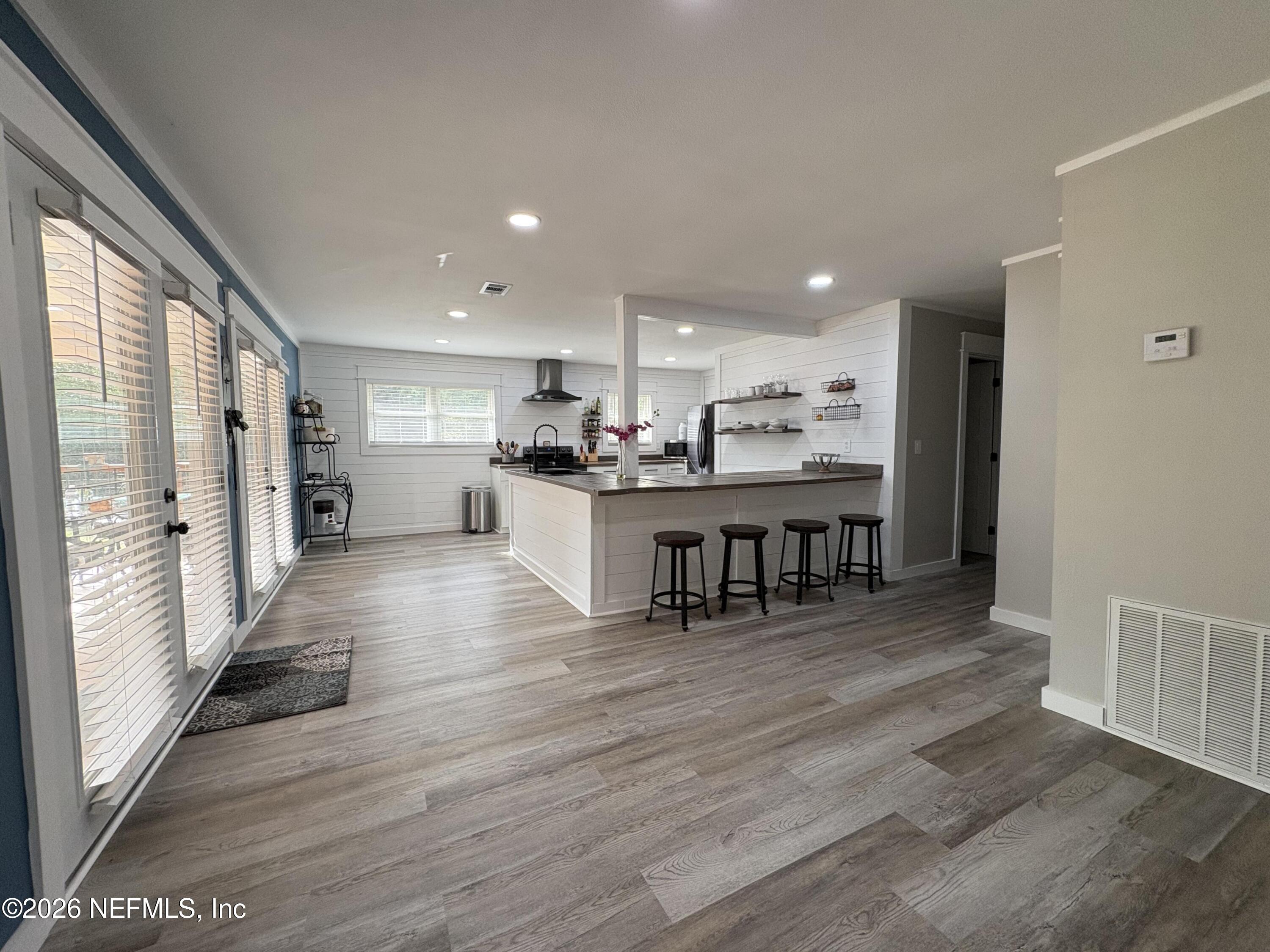 165 Fulton Road Palatka, FL 32177 - Photo 10 of 26 a kitchen with stainless steel appliances granite countertop a refrigerator and a stove top oven