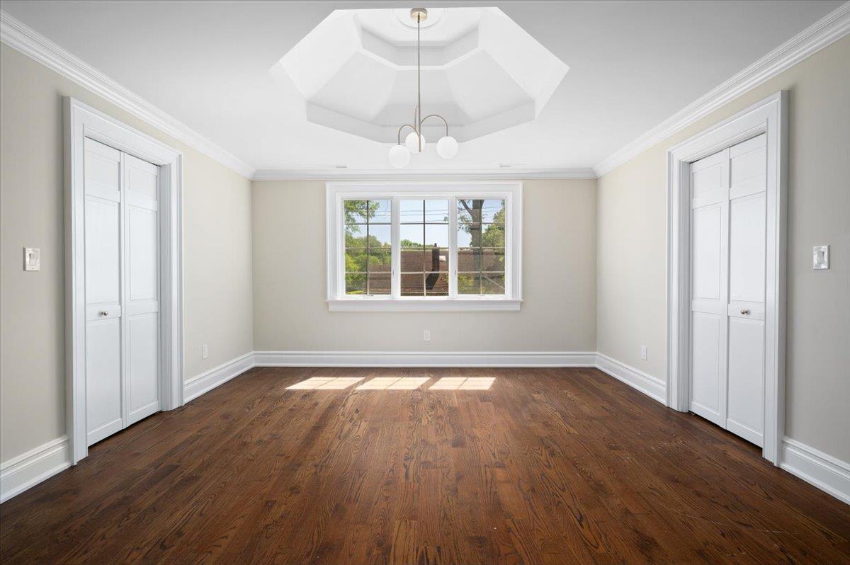 4 Clover Place New Rochelle, NY 10805 - Photo 22 of 38 a view of an empty room with wooden floor and a window