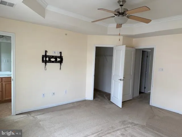 a view of storage and utility room with closet