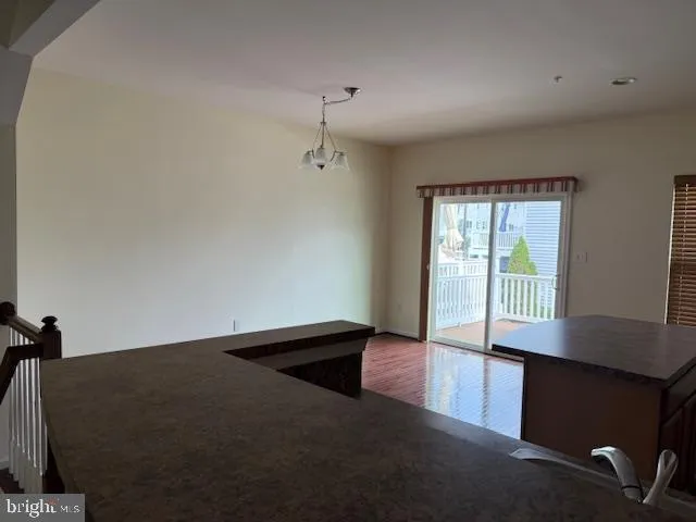 a kitchen with stainless steel appliances granite countertop a sink a stove a refrigerator a microwave and cabinets