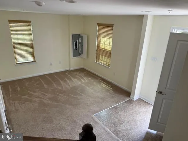 a view of a hallway with windows