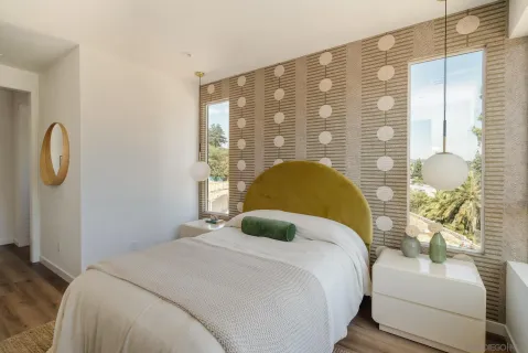 a bedroom with a bed and a window