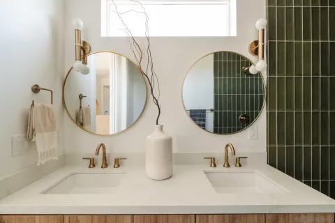 a bathroom with a sink and mirror