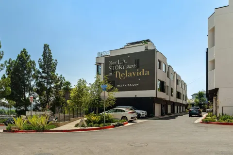 a front view of a building with garden