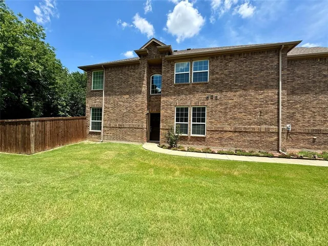 a view of a backyard with a small cabin
