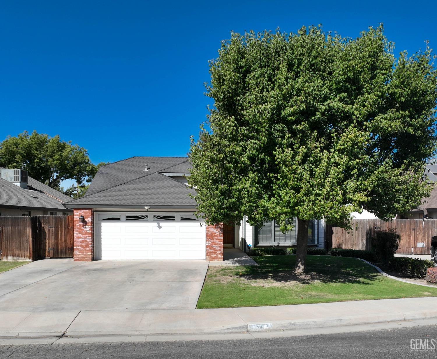 a front view of a house with yard