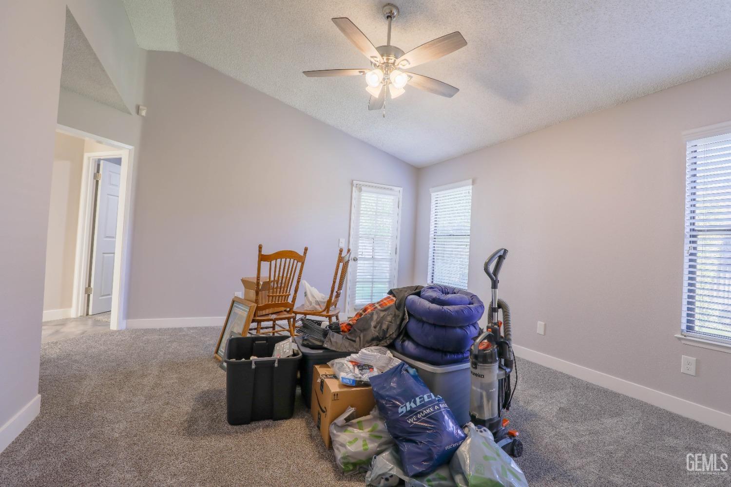 Undisclosed Address Bakersfield, CA 93313 - Photo 14 of 21 a room with furniture a chandelier and a window