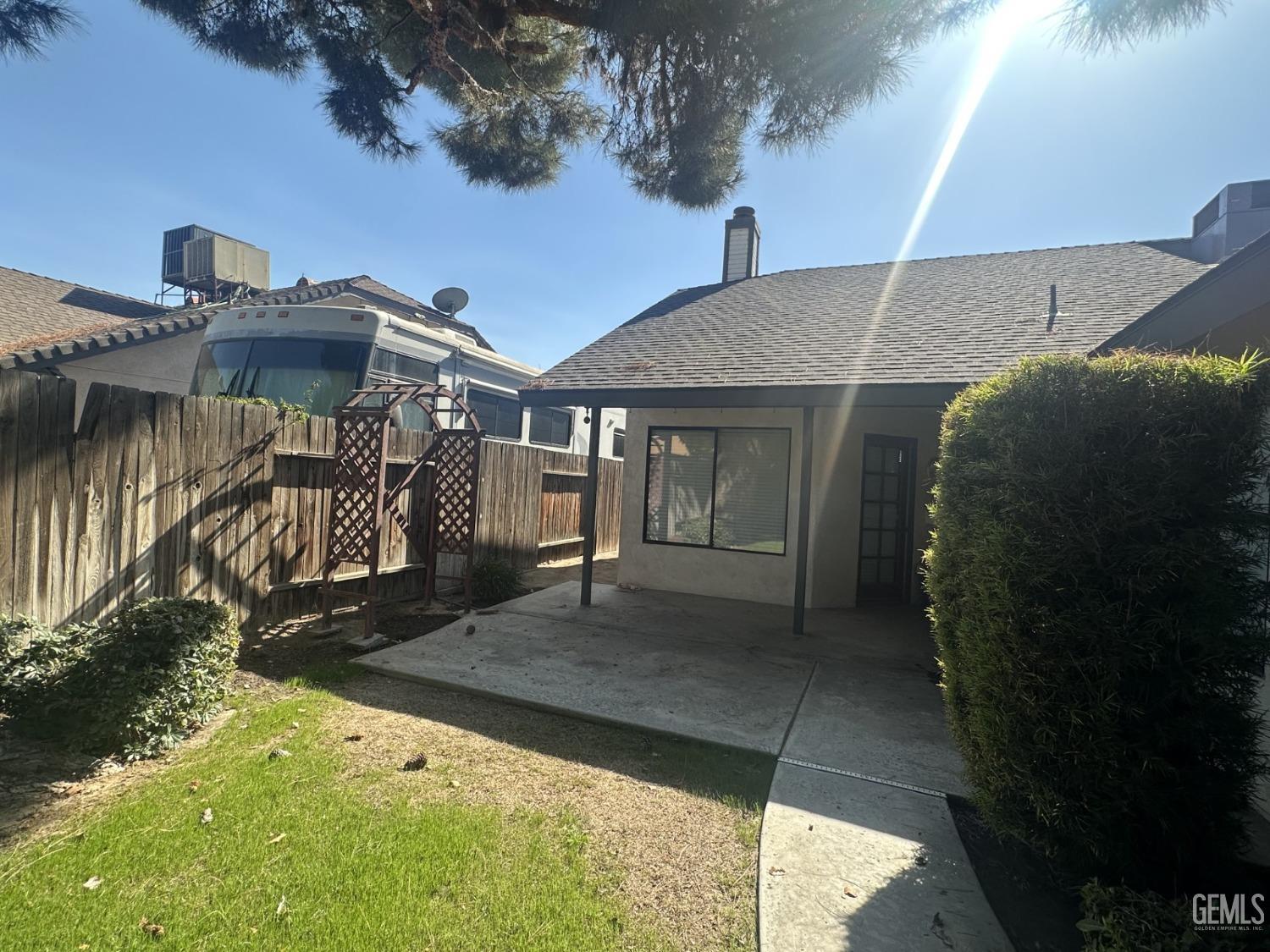 Undisclosed Address Bakersfield, CA 93313 - Photo 20 of 21 a front view of a house with a yard