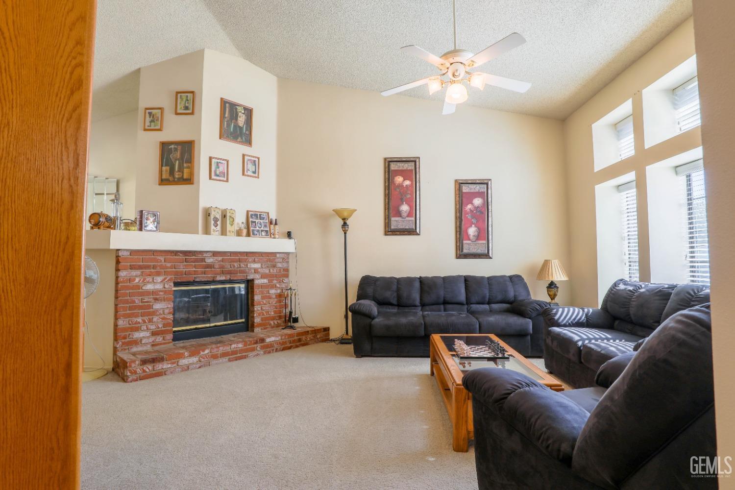 Undisclosed Address Bakersfield, CA 93313 - Photo 5 of 21 a living room with furniture and a fireplace