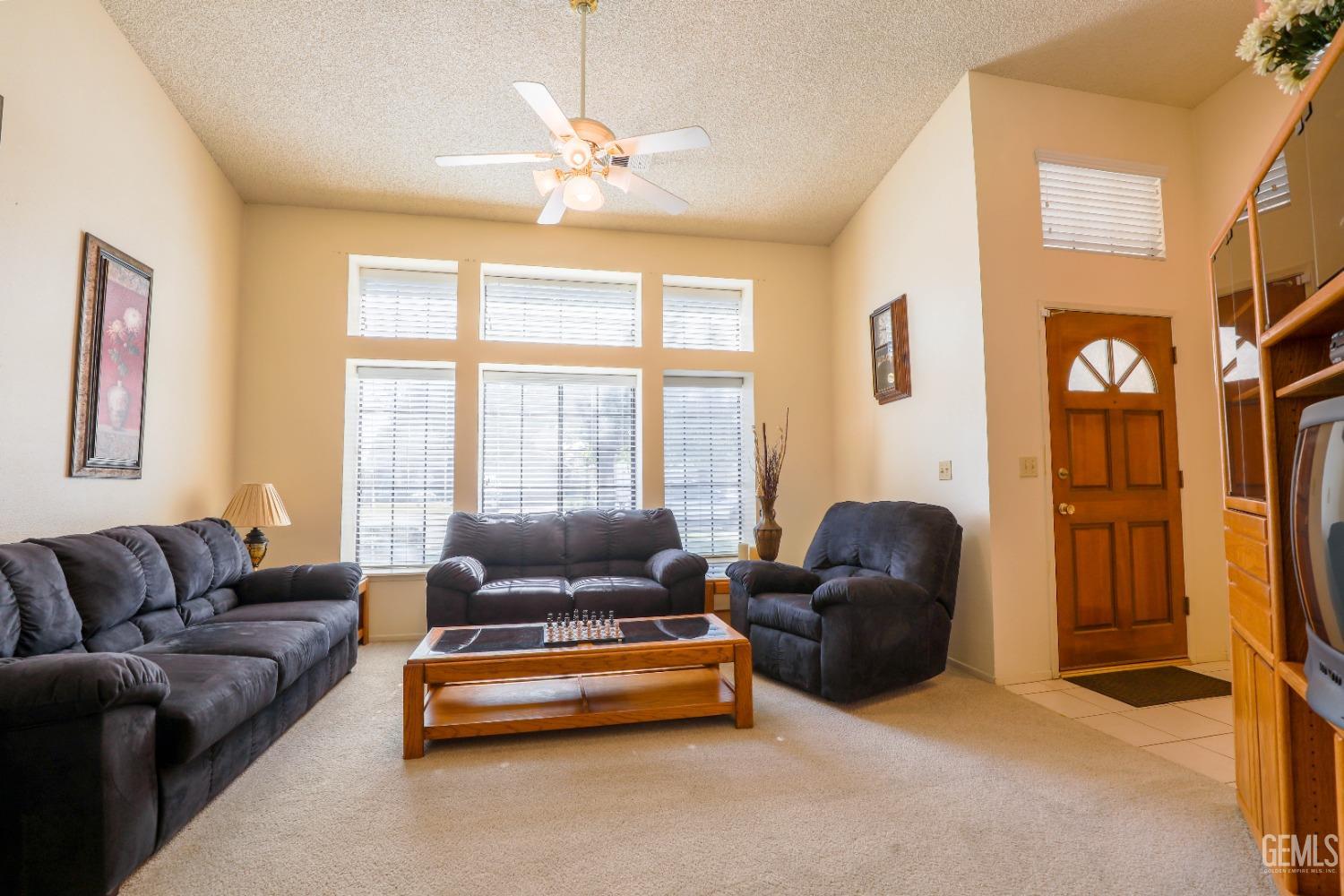 Undisclosed Address Bakersfield, CA 93313 - Photo 6 of 21 a living room with furniture and a large window