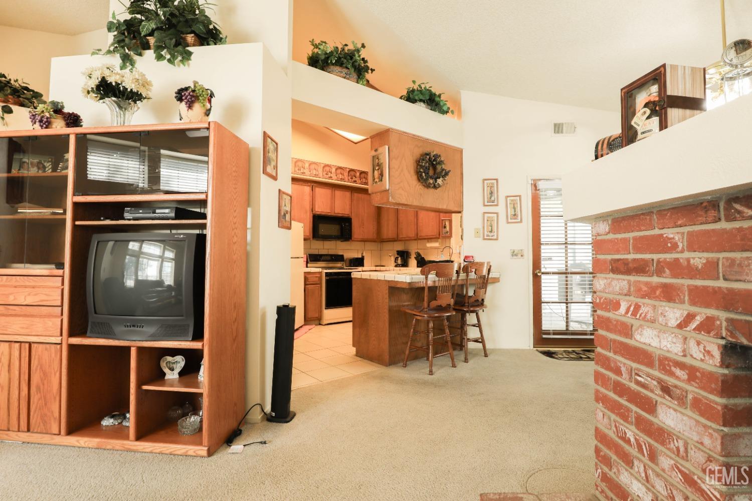 Undisclosed Address Bakersfield, CA 93313 - Photo 7 of 21 a dining room with furniture and a window