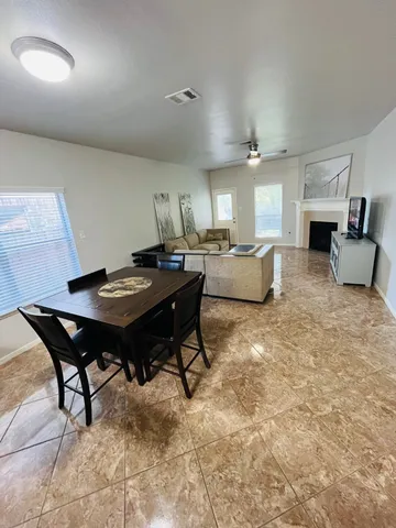 a living room with furniture and a table
