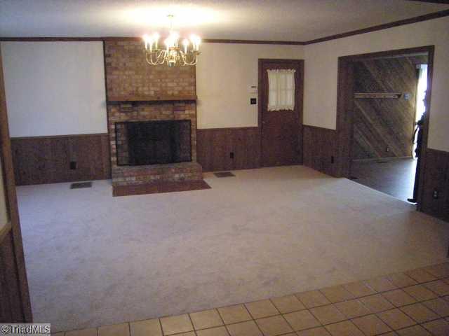 1796 Sandy Ridge Road Kernersville, NC 27284 - Photo 10 of 10 Living Room. Large open floor plan with masonry fireplace