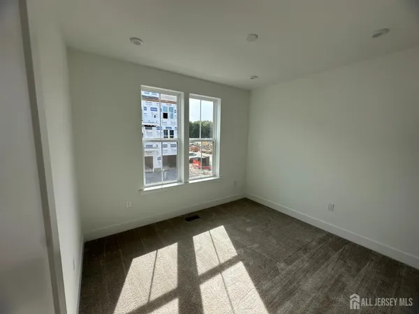 a view of brick building with large windows