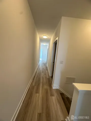 a bathroom with a sink a toilet a mirror and shower