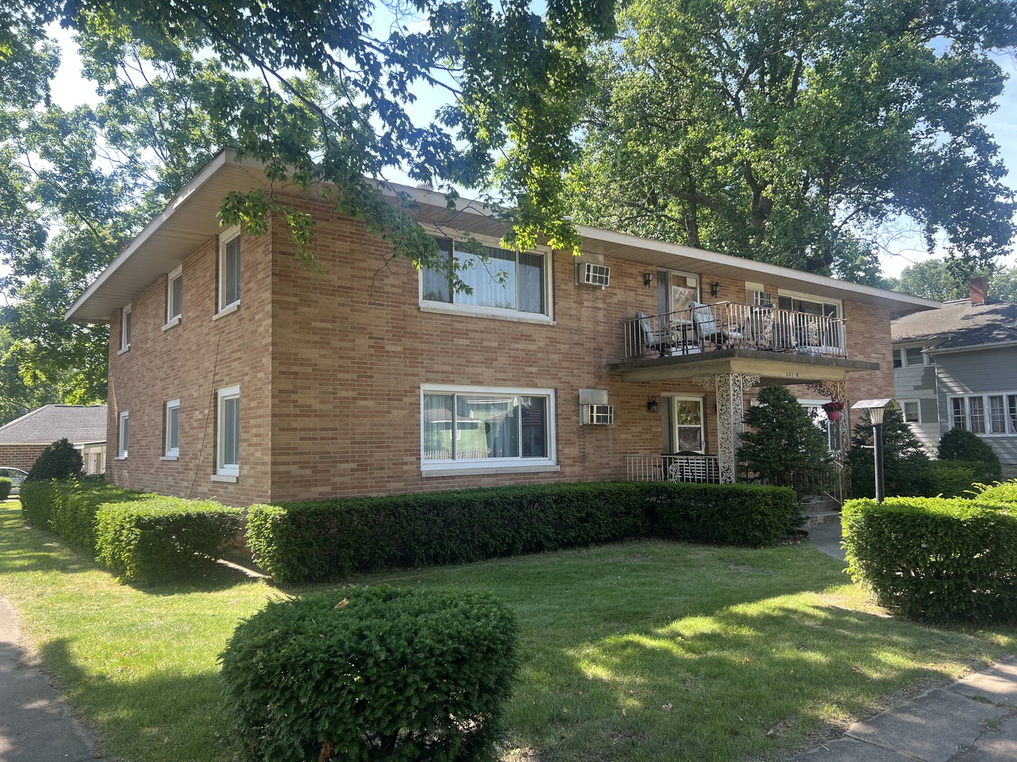 301 North Minier Avenue, Unit 1 Minier, IL 61759 - Photo 1 of 7 a view of a house with a yard plants and a patio