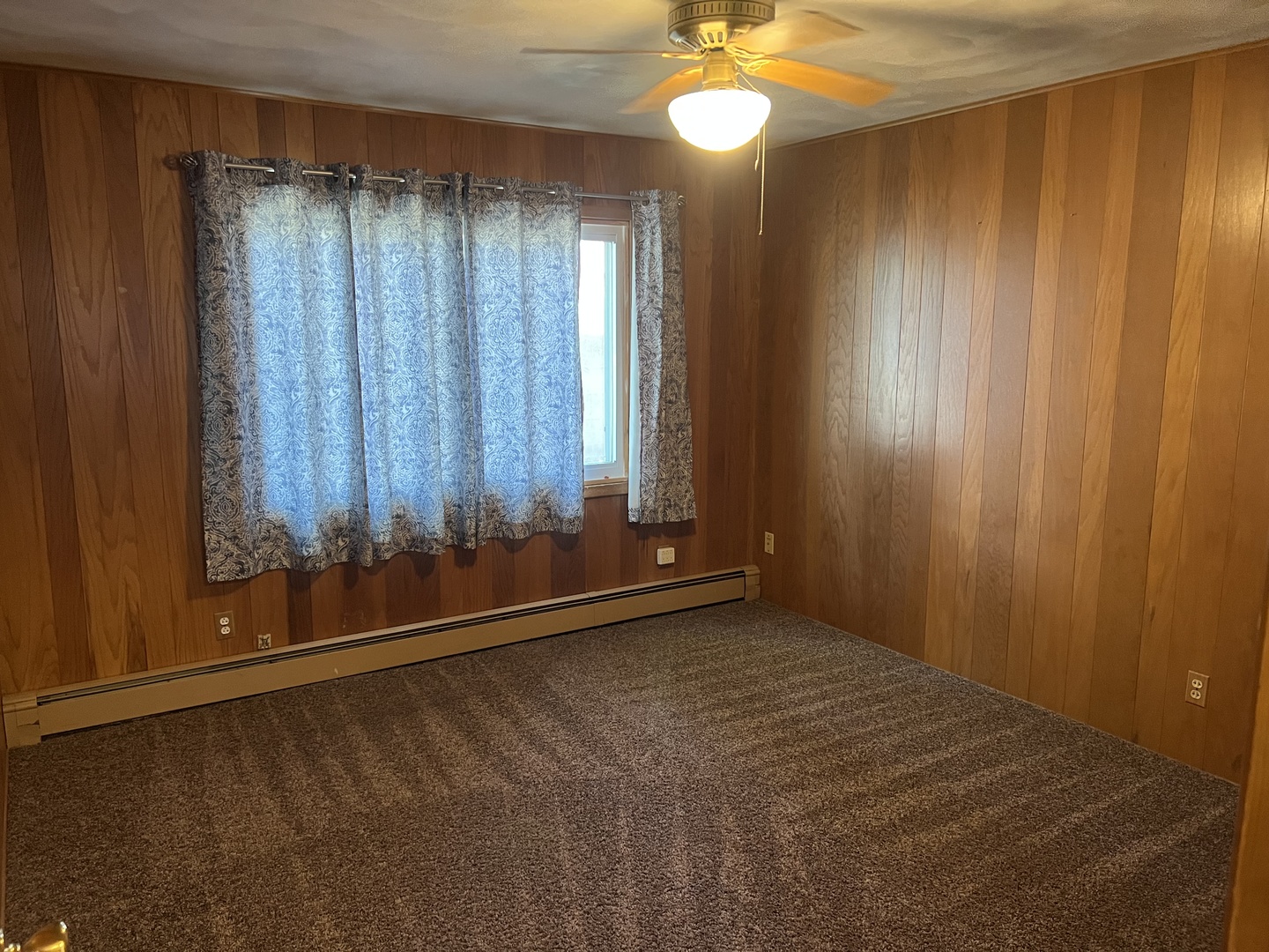 301 North Minier Avenue, Unit 1 Minier, IL 61759 - Photo 6 of 7 a view of an empty room with a window
