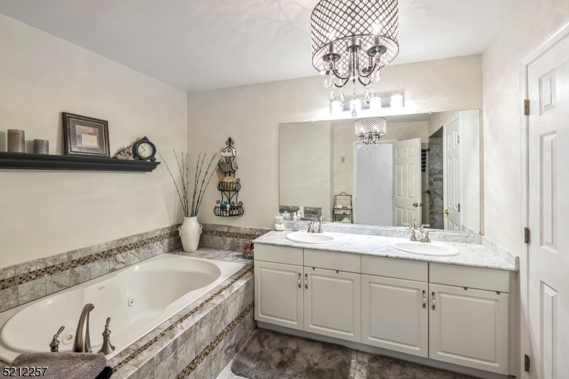 9 O'Connor Circle West Orange, NJ 07052 - Photo 18 of 29 a bathroom with a tub sink and mirror