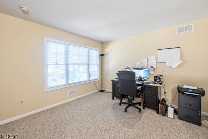9 O'Connor Circle West Orange, NJ 07052 - Photo 23 of 29 a view of a workspace with furniture and a window