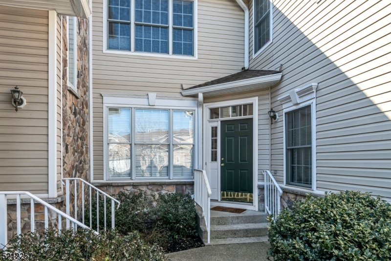 9 O'Connor Circle West Orange, NJ 07052 - Photo 3 of 29 a view of a house with a large window and potted plants