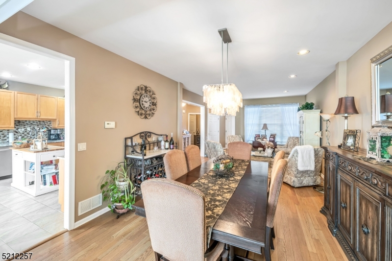 9 O'Connor Circle West Orange, NJ 07052 - Photo 9 of 29 a view of a dining room with furniture a chandelier and wooden floor
