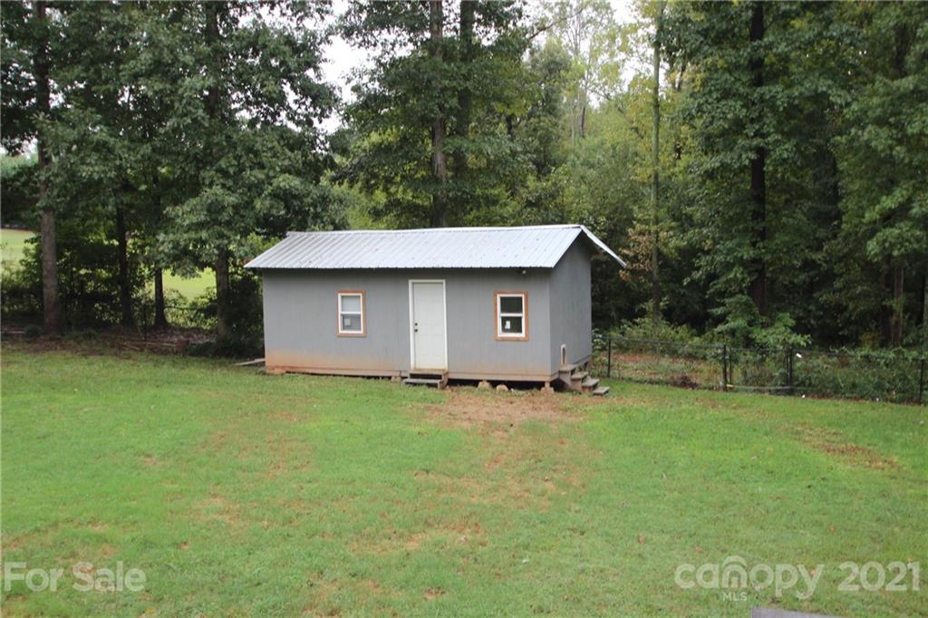 755 Shady Forest Road Clover, SC 29710 - Photo 4 of 12 a view of a backyard with a garden