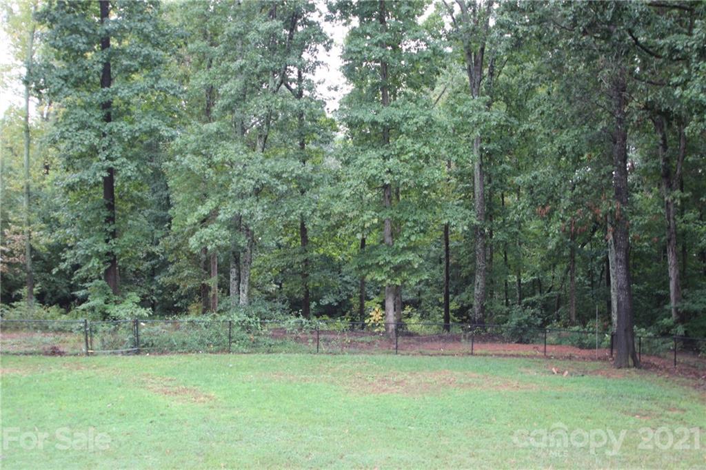 755 Shady Forest Road Clover, SC 29710 - Photo 5 of 12 a view of a field with trees in the background