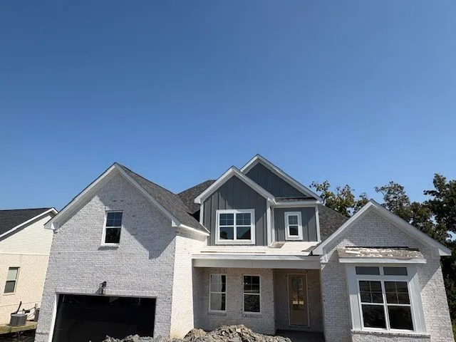 a front view of a house with yard