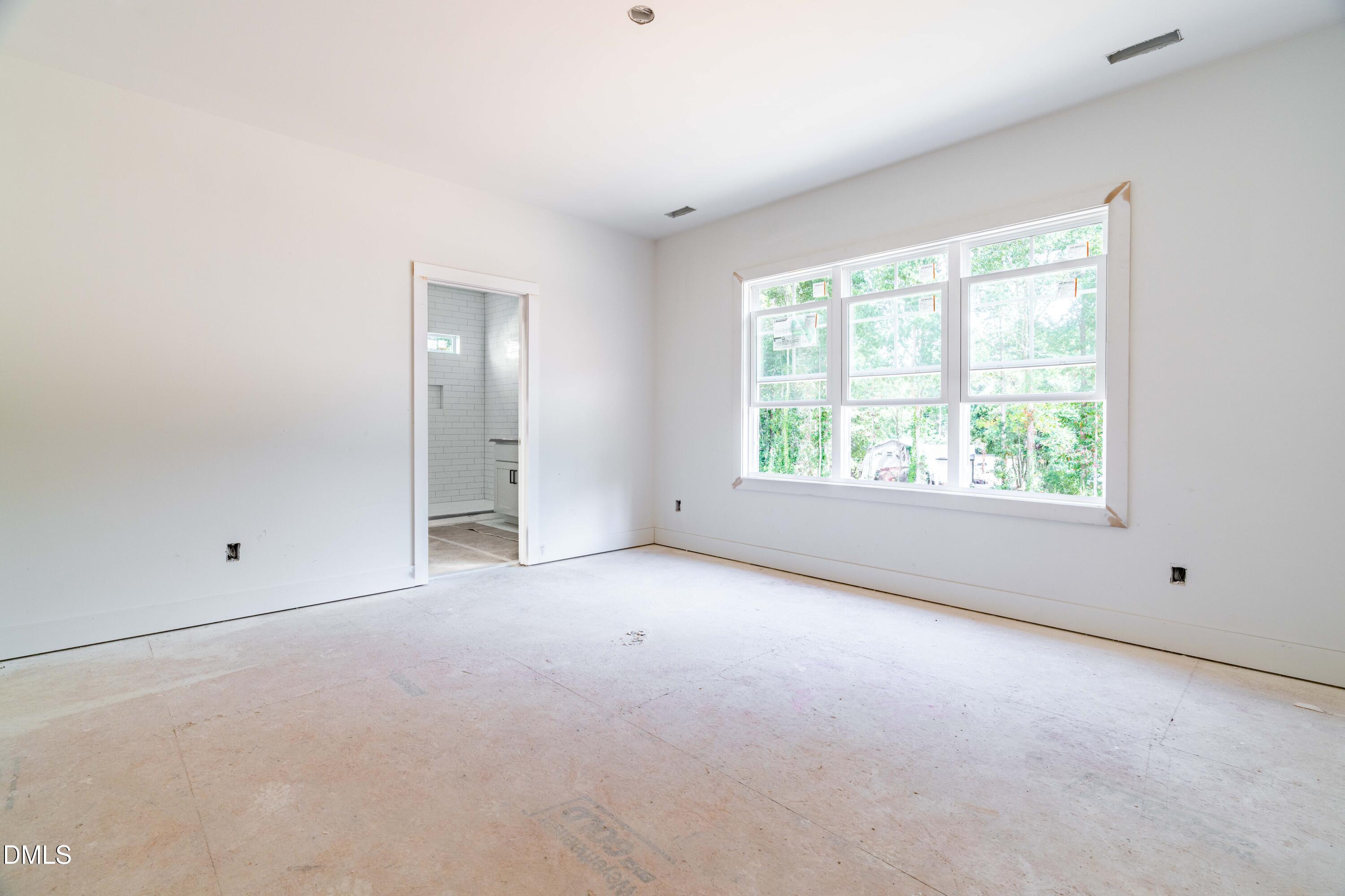 1032 Harper Road Raleigh, NC 27603 - Photo 21 of 62 an empty room with windows and closet