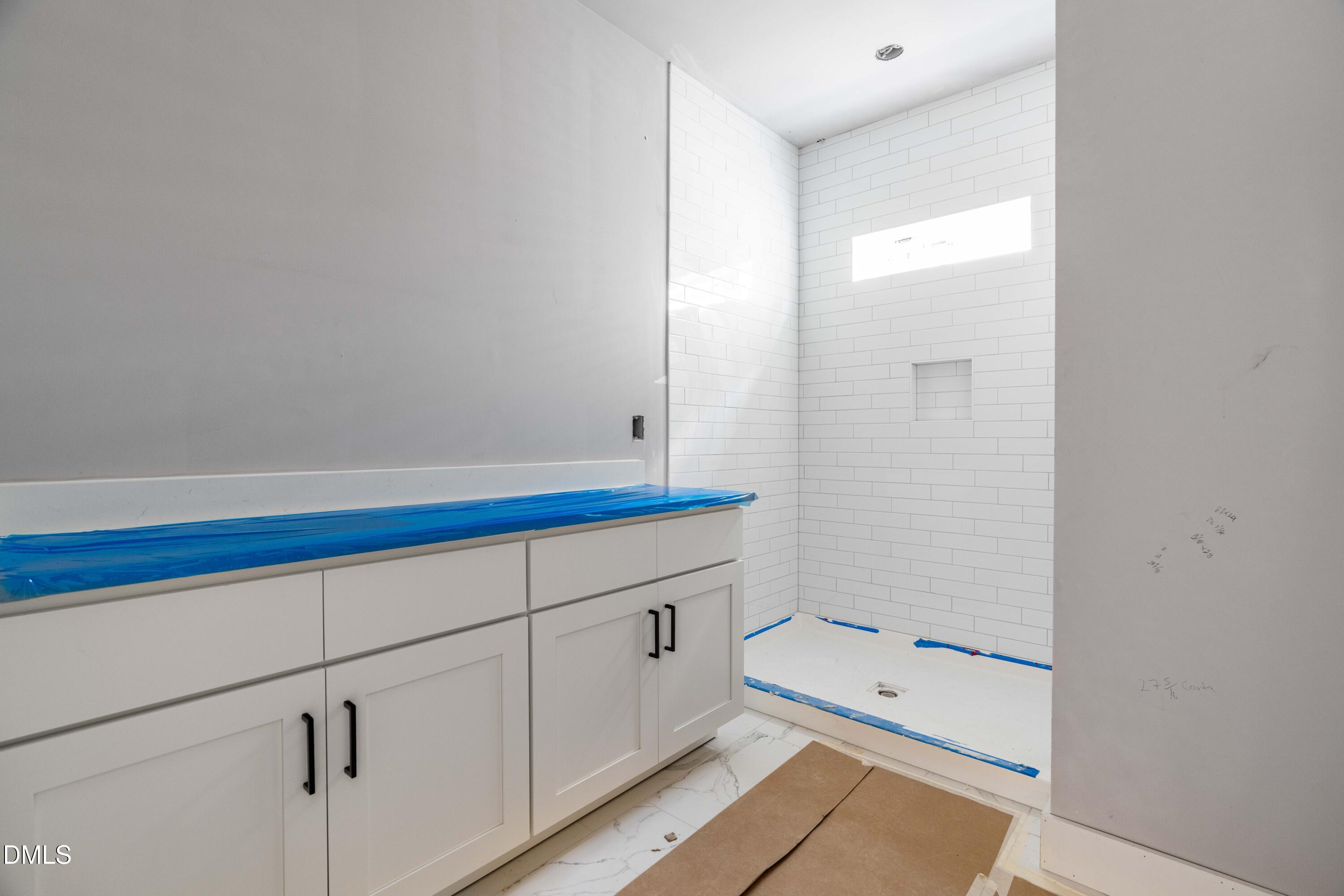 1032 Harper Road Raleigh, NC 27603 - Photo 22 of 62 a bathroom with a tub and a sink
