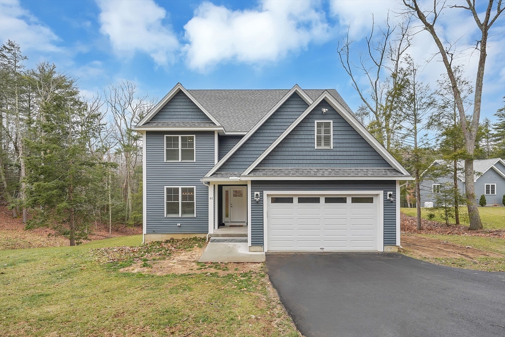 61 New Boston Road Sturbridge, MA 01566 - Photo 1 of 42 a front view of a house with garden