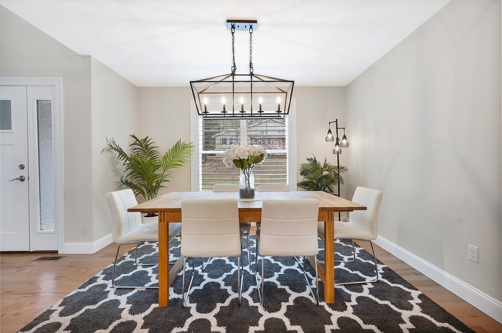 61 New Boston Road Sturbridge, MA 01566 - Photo 18 of 42 a view of a dining room with furniture and wooden floor