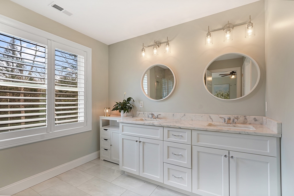 61 New Boston Road Sturbridge, MA 01566 - Photo 27 of 42 a bathroom with a double vanity sink and a mirror