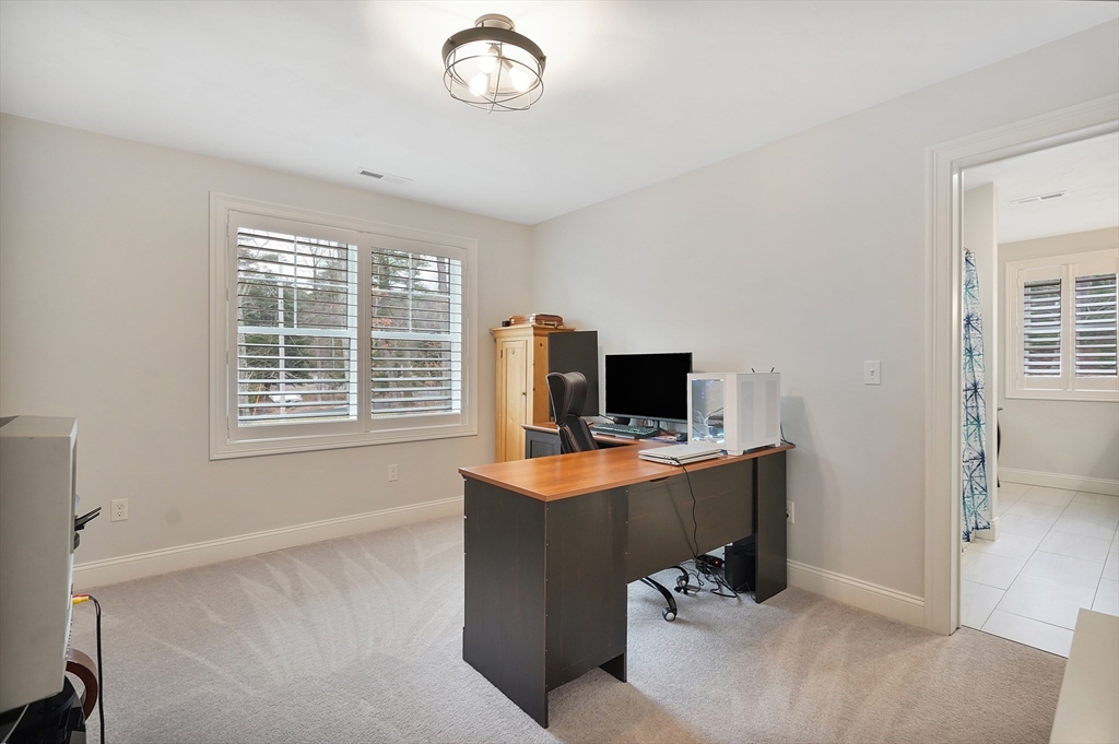 61 New Boston Road Sturbridge, MA 01566 - Photo 33 of 42 a view of a workspace with furniture and a window