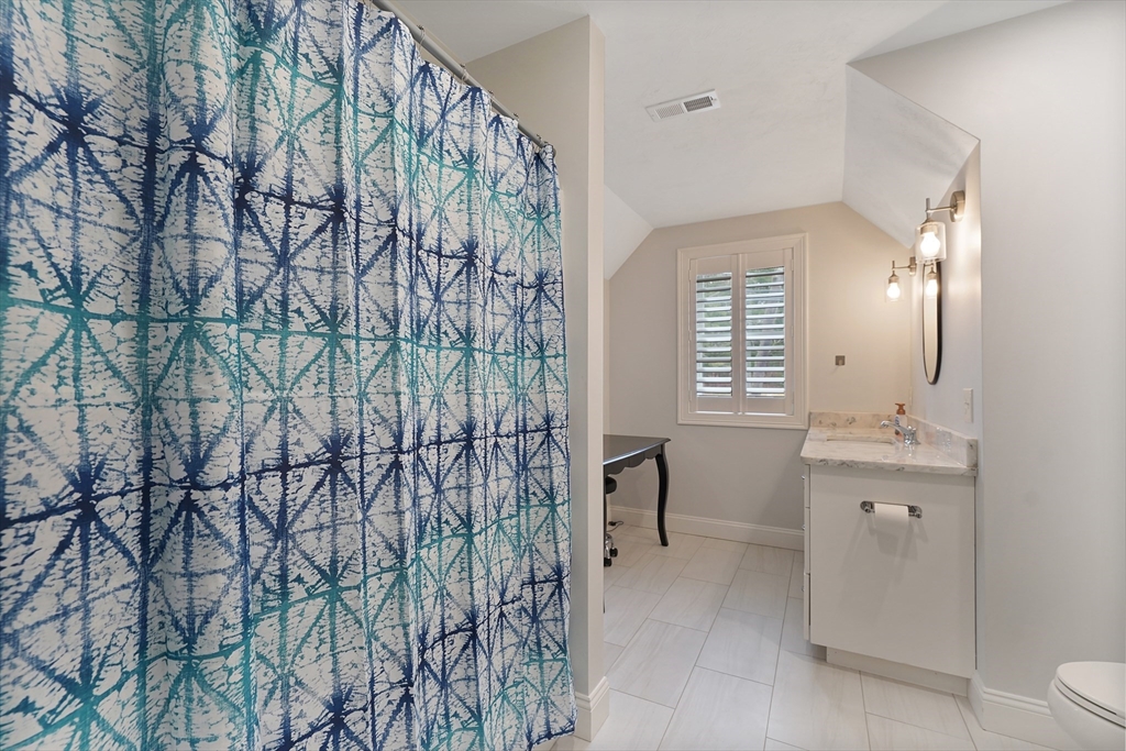 61 New Boston Road Sturbridge, MA 01566 - Photo 35 of 42 a bathroom with a shower curtain and a sink