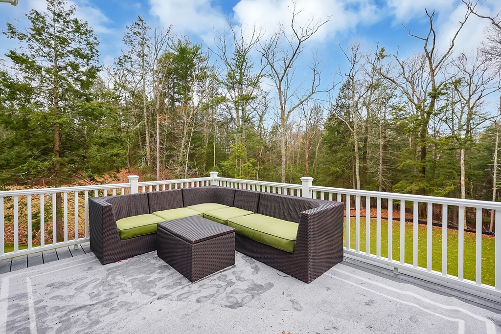 61 New Boston Road Sturbridge, MA 01566 - Photo 37 of 42 a roof deck with couches and wooden fence