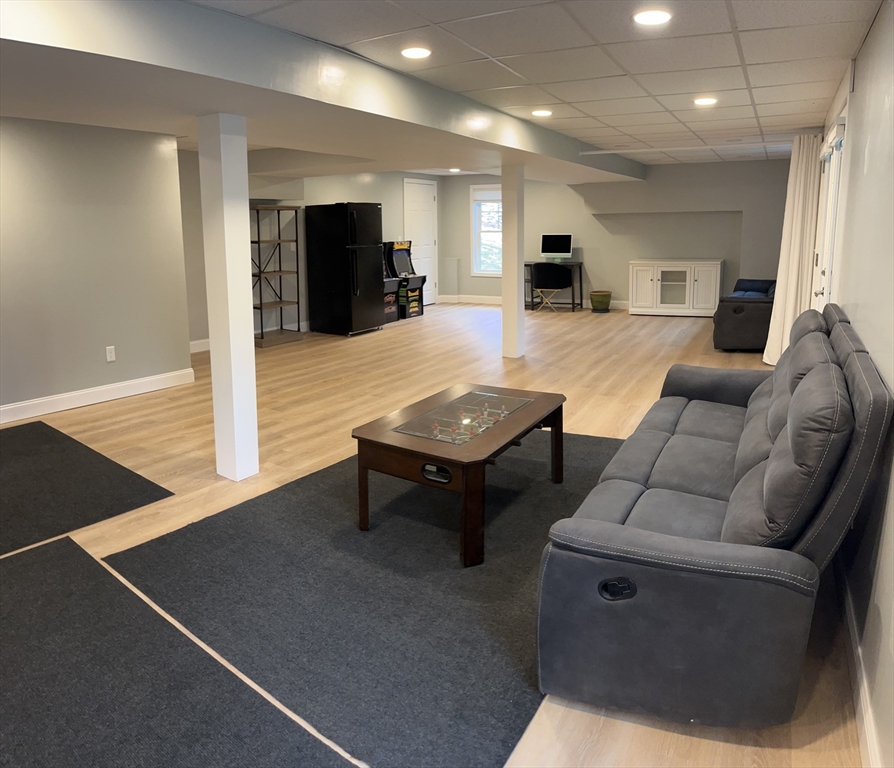 61 New Boston Road Sturbridge, MA 01566 - Photo 40 of 42 a living room with furniture and a table