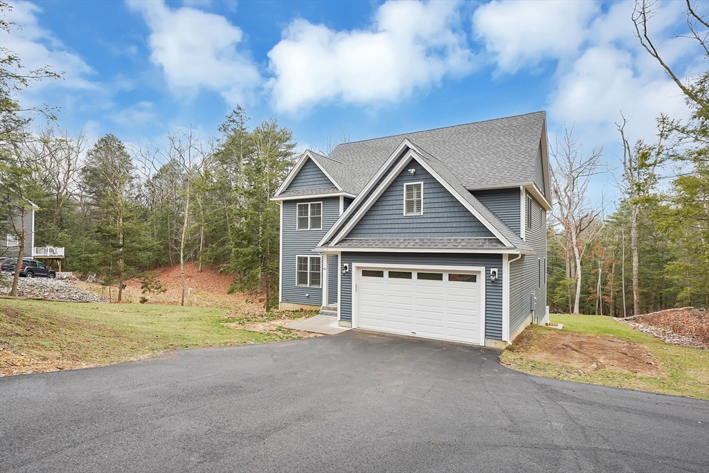61 New Boston Road Sturbridge, MA 01566 - Photo 4 of 42 a view of a house with large trees and a big yard