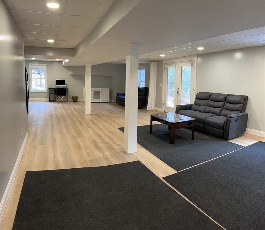 61 New Boston Road Sturbridge, MA 01566 - Photo 41 of 42 a living room with furniture and a table