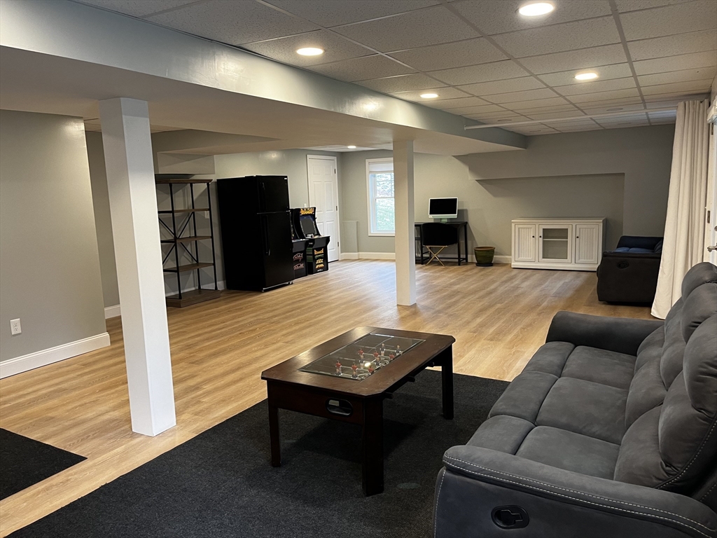 61 New Boston Road Sturbridge, MA 01566 - Photo 42 of 42 a living room with furniture and a wooden floor