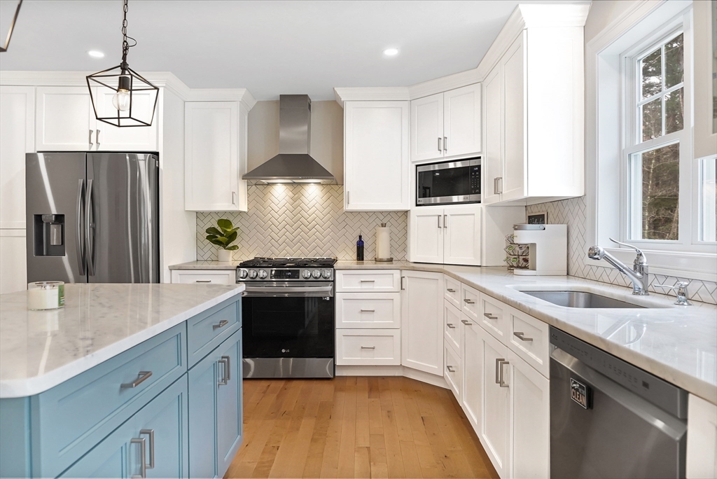 61 New Boston Road Sturbridge, MA 01566 - Photo 10 of 42 a kitchen with stainless steel appliances granite countertop a sink stove and refrigerator