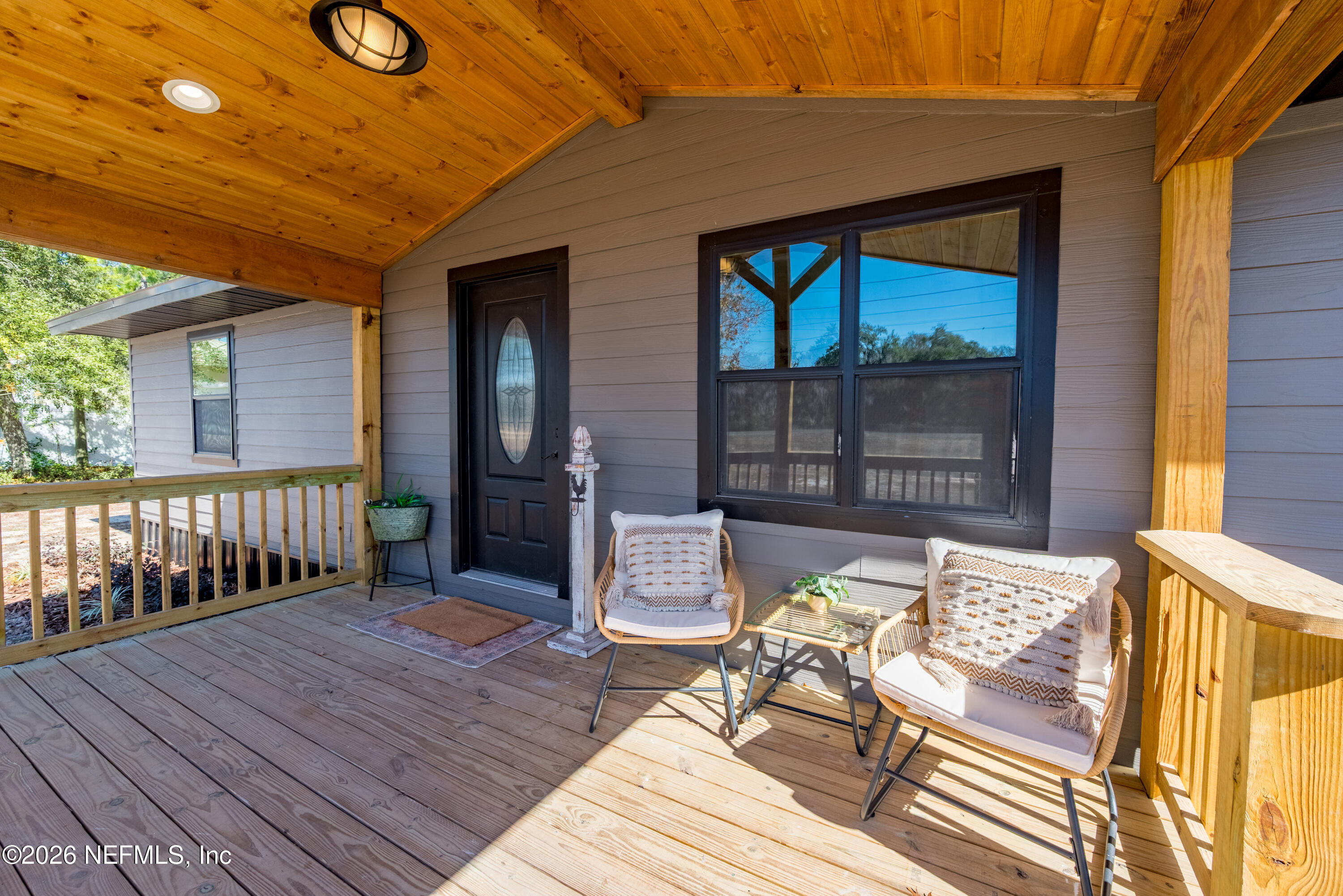 4193 Southeast 8th Avenue Keystone Heights, FL 32656 - Photo 1 of 53 a balcony with furniture and wooden floor