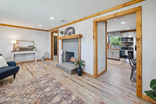 a view of a dining room with furniture window and wooden floor