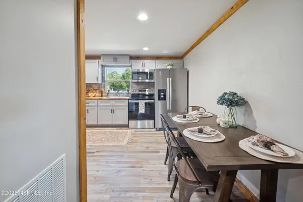 a kitchen with stainless steel appliances granite countertop a refrigerator sink and cabinets