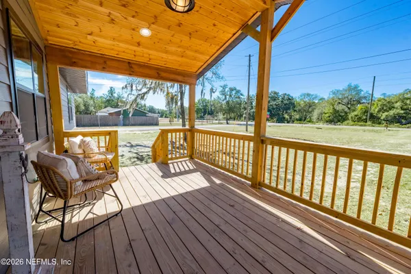 a view of a two chairs in the patio