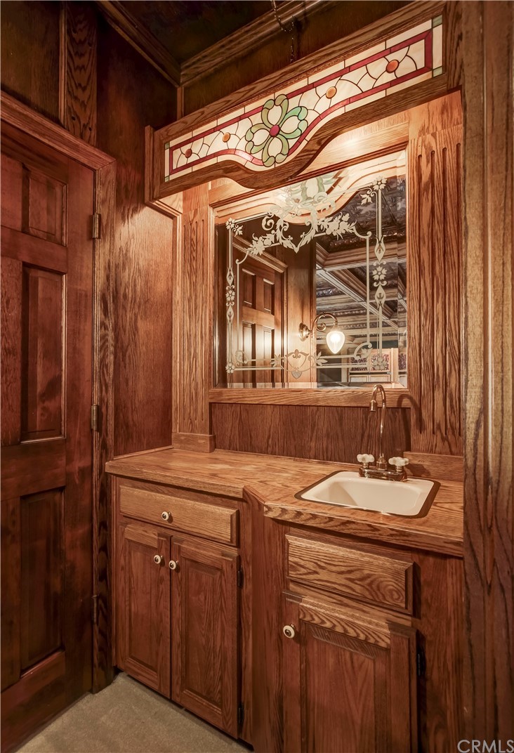 1632 Smiley Heights Drive Redlands, CA 92373 - Photo 25 of 75 a bathroom with a sink and a mirror